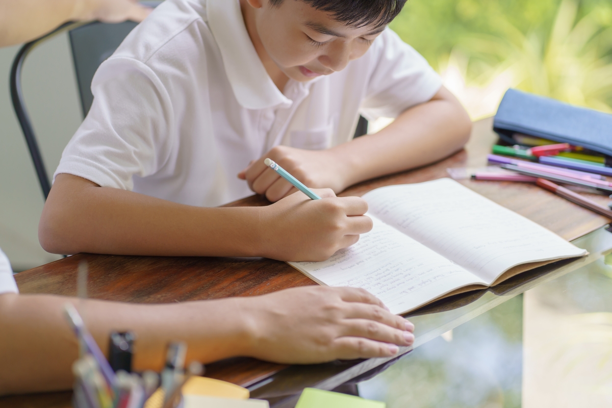 Boy studying and following a study schedule