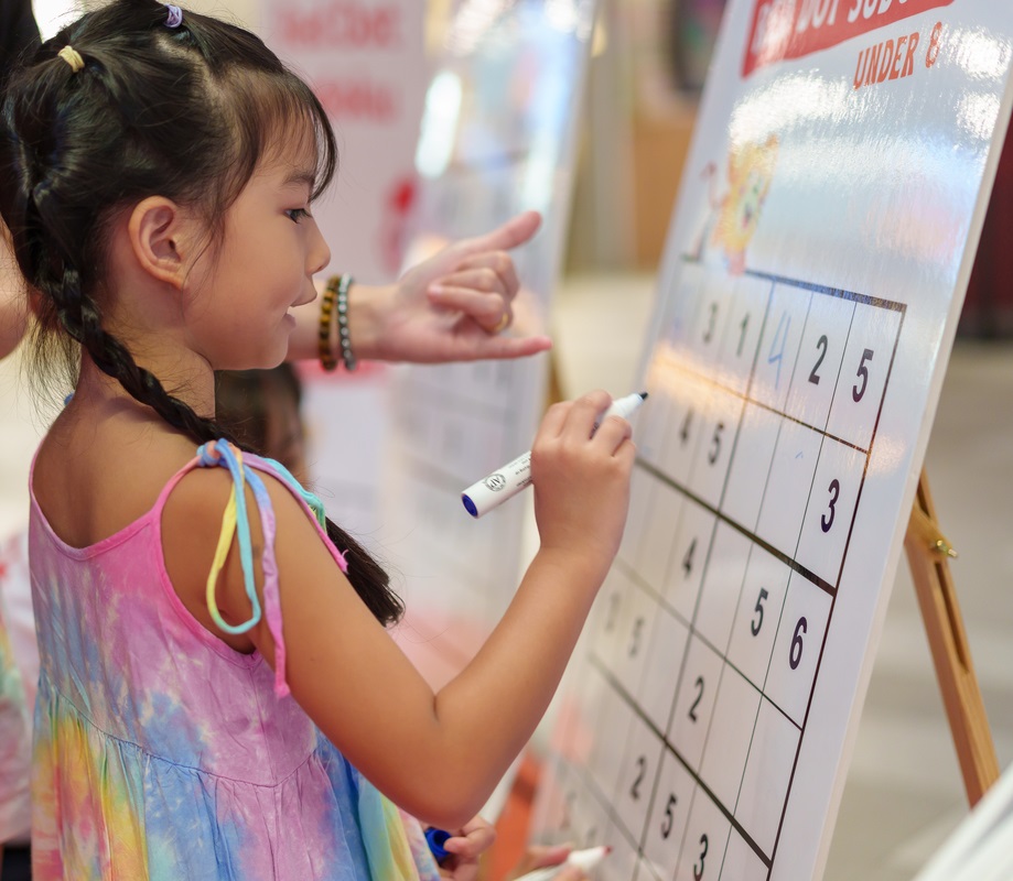 Young girl trying sudoku and taking part in sudoku challenge