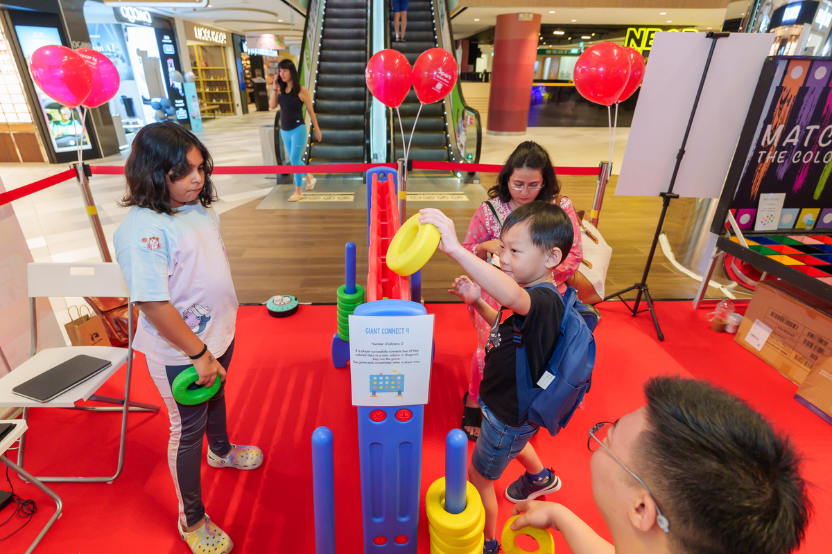 Children's Day Celebration children playing giant Connect 4 test problem solving skills