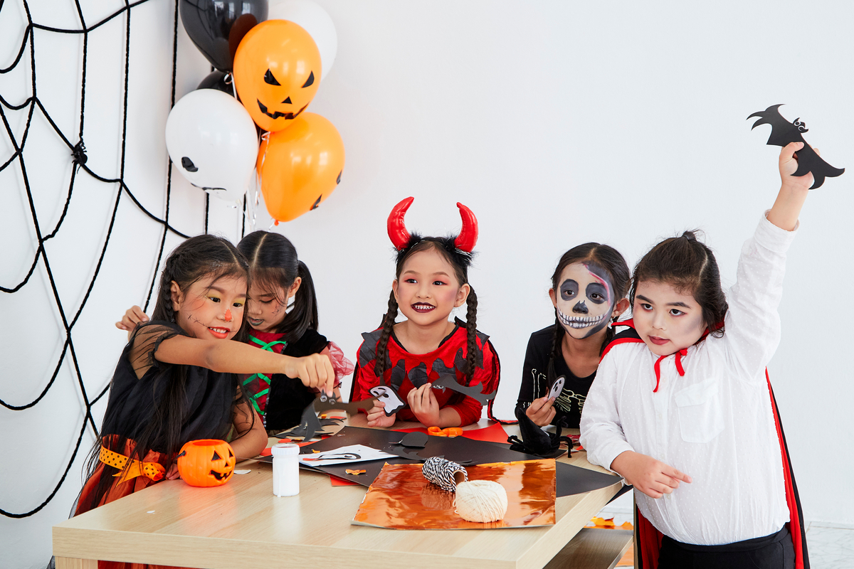 Free Primary 4 Math Worksheets for Halloween children dressed up and celebrating Halloween party