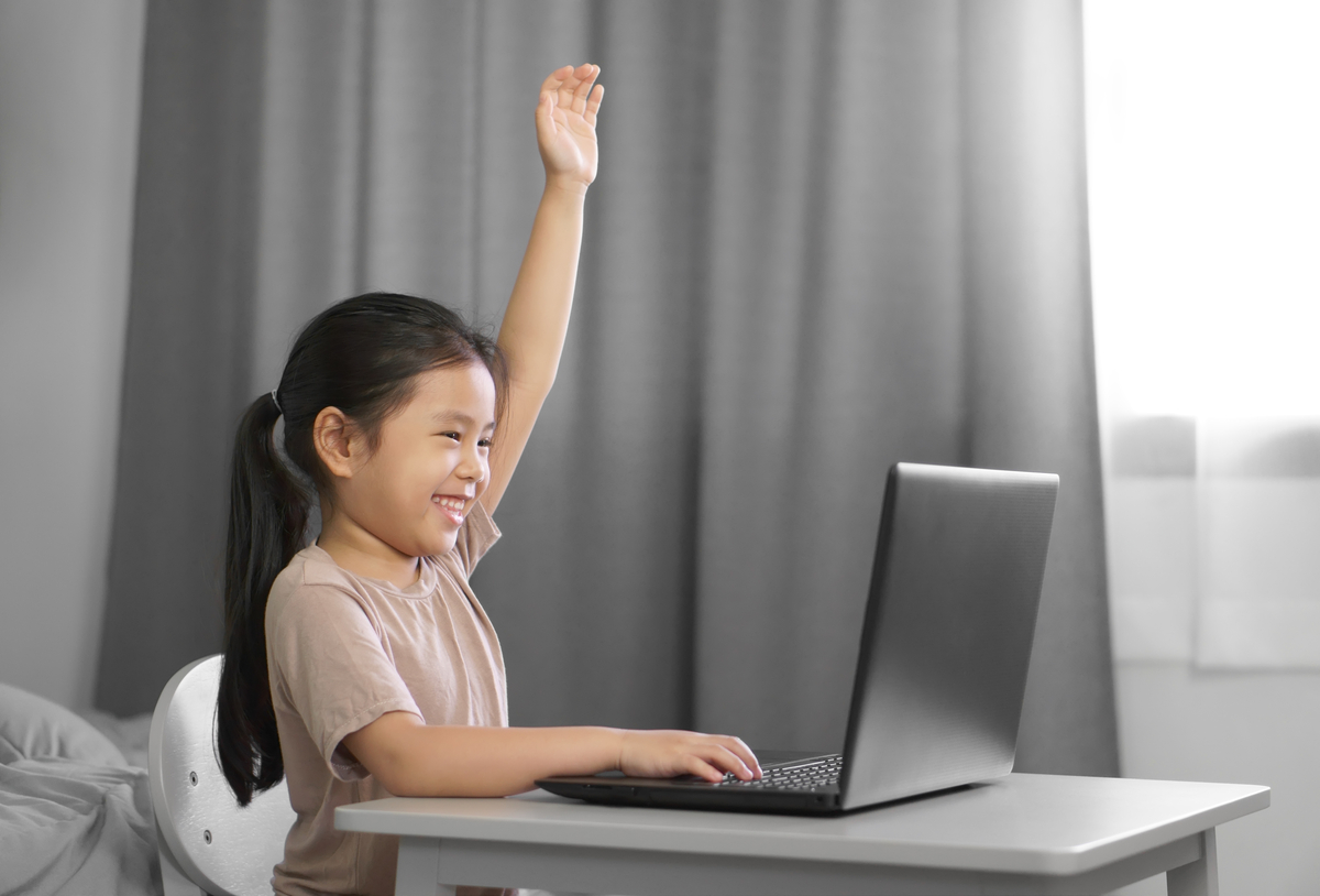 Girl having online lesson with online teachers on laptop