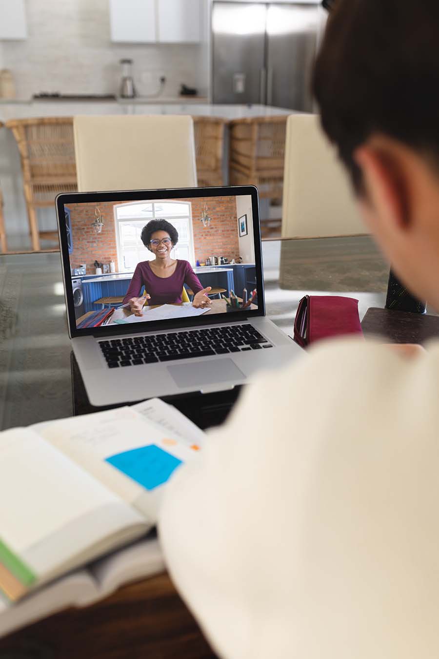 Student on screen of online teachers laptop