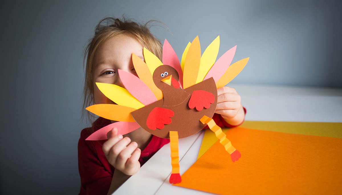 Free Thanksgiving  Kindergarten Math Worksheets Kid playing with paper turkey