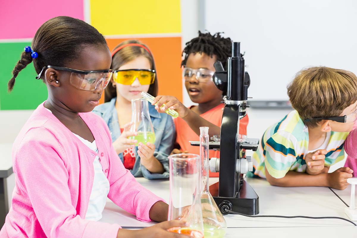 Celebrate International STEM DAY with Spark Education! Kids doing science