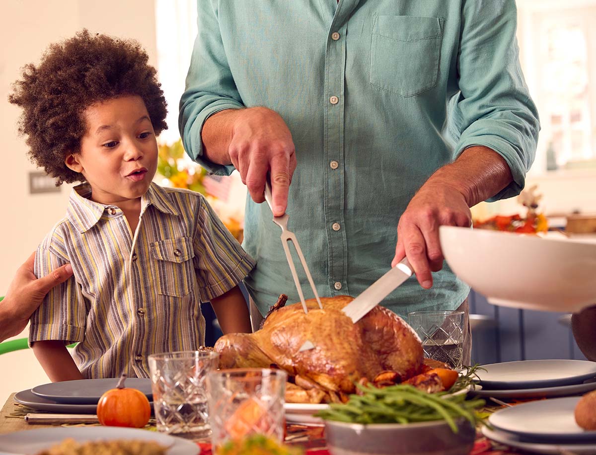 Kid watching parent carve turkey Free thanksgiving 3rd grade worksheets