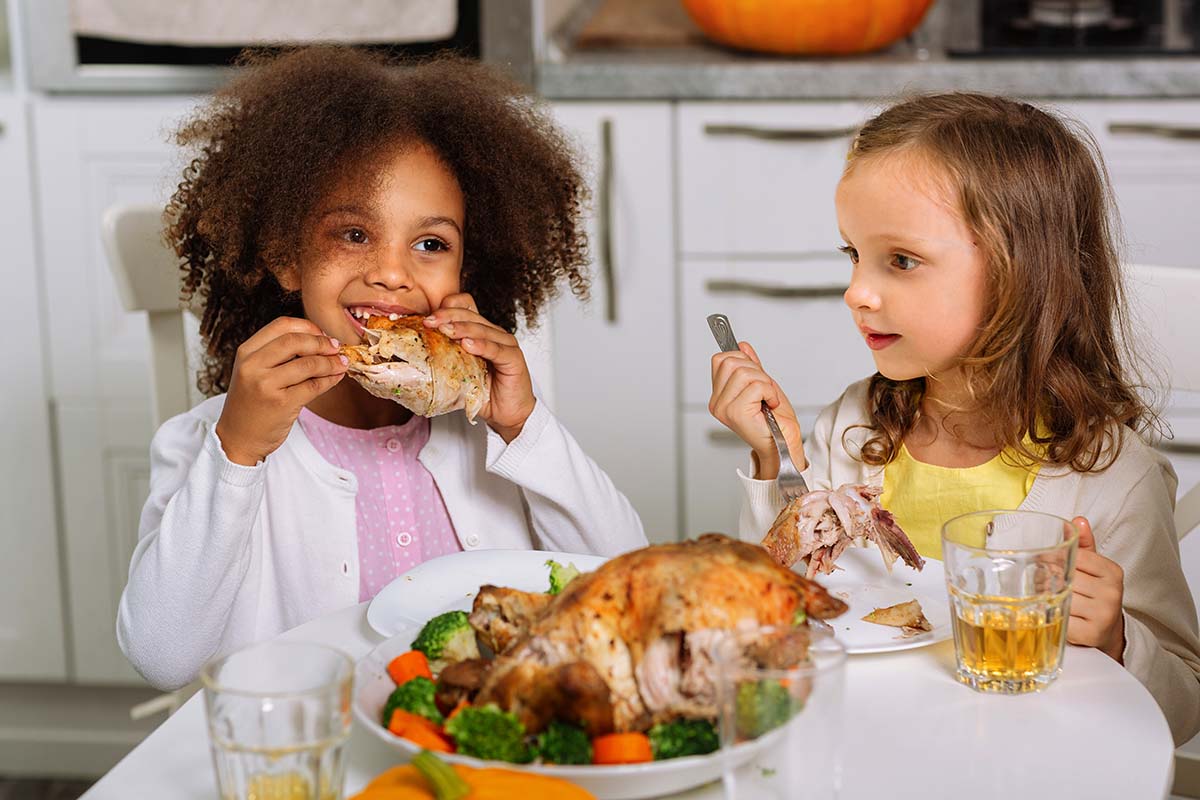 2 Little girls eating thanksgiving dinner Free thanksgiving 1st grade worksheets