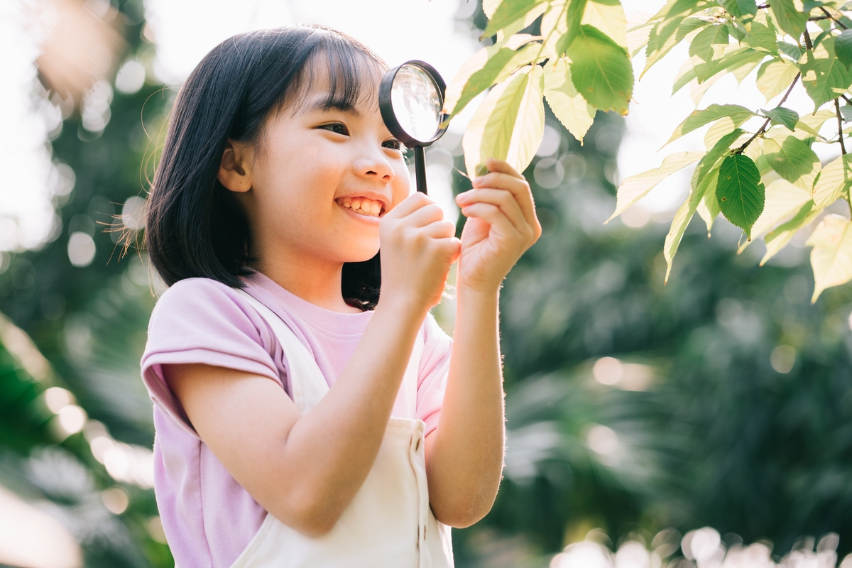 International STEM Day girl studying plants 