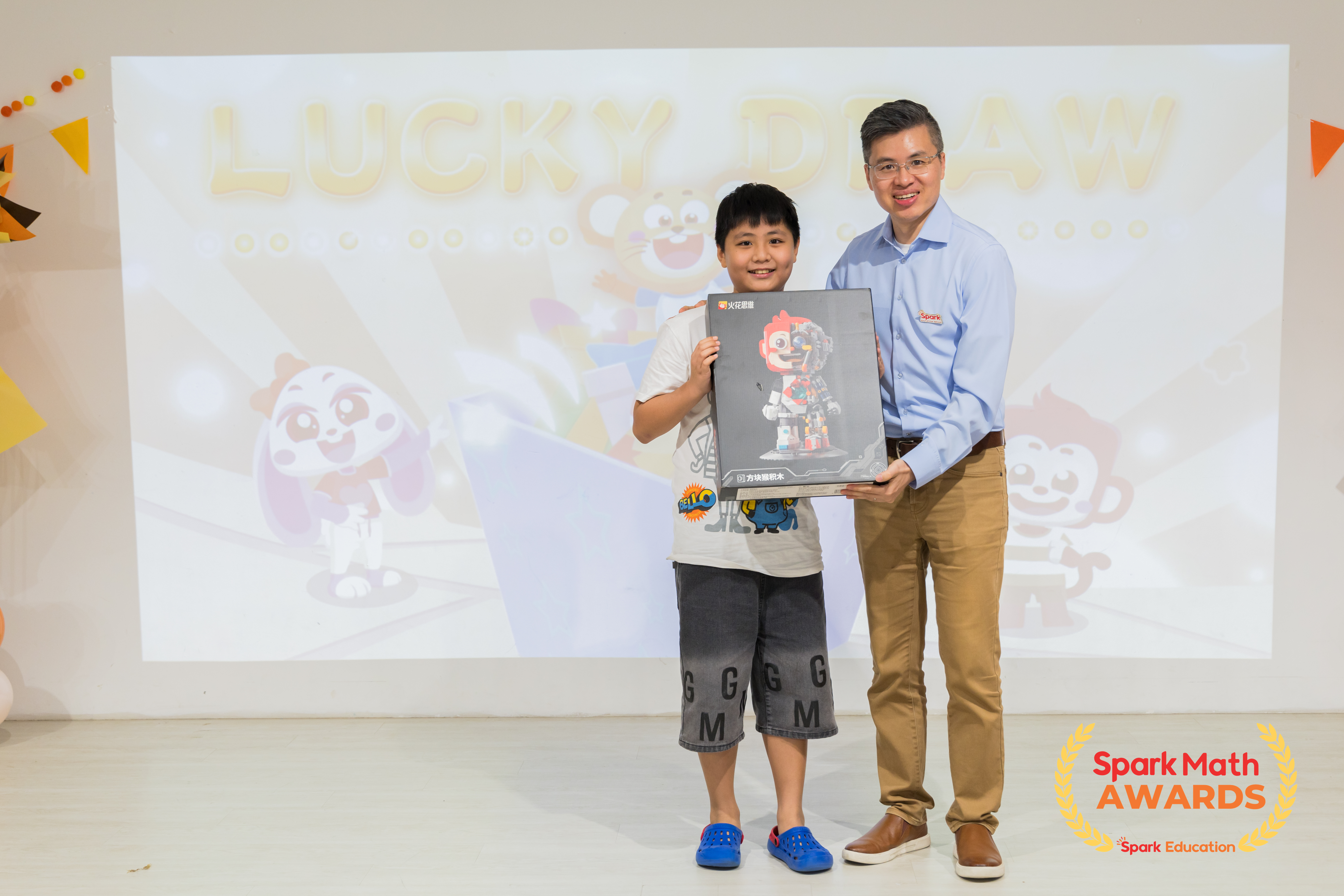 Mr Xiaonan Wang, Co-founder of Spark Education, drawing the lucky winner for our limited-edition Benny lego set.
